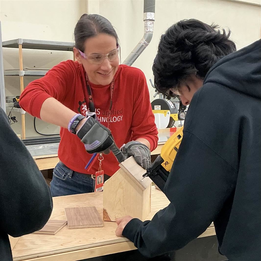  Ceja with a student in Applied Technology