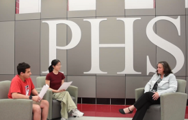  Lisa Small sits with two students at Palatine High School for an interview